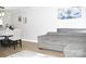 Inviting living room features hardwood floors, grey sofa and artistic decor at 12742 Spirit Bound Way, Charlotte, NC 28273