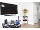 View of living room showcasing entertainment center and doorway with stairs at 12742 Spirit Bound Way, Charlotte, NC 28273