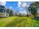 Expansive backyard with green lawn and trees, perfect for outdoor activities and relaxation at 1301 Old Farm Rd, Charlotte, NC 28226