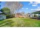 Spacious backyard featuring a storage shed and mature trees at 1301 Old Farm Rd, Charlotte, NC 28226