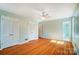 Spacious bedroom with hardwood floors, two closets, and access to an en-suite bathroom at 1301 Old Farm Rd, Charlotte, NC 28226
