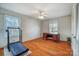 Bedroom with a treadmill, desk, and hardwood flooring at 1301 Old Farm Rd, Charlotte, NC 28226