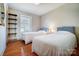 Cozy bedroom with hardwood floors, two twin beds, and a bright window at 1301 Old Farm Rd, Charlotte, NC 28226