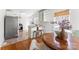 Cozy breakfast nook features wood floors, a round table, and natural light pouring in through multiple windows at 1416 Woodland Dr, Charlotte, NC 28205