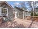 Back deck with wood railings, and access to the house at 1416 Woodland Dr, Charlotte, NC 28205