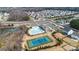 Aerial view showcases the neighborhood pool, clubhouse, and tennis court surrounded by lush landscaping and residential homes at 14815 Superior St, Charlotte, NC 28273