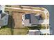Aerial rooftop view featuring solar panels, fenced yard, and outdoor living at 14815 Superior St, Charlotte, NC 28273