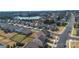 The aerial perspective reveals a peaceful residential area near a lake with well-maintained lawns and homes lining the streets at 14815 Superior St, Charlotte, NC 28273