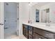 Bathroom featuring a double vanity, large mirror, and ensuite bedroom at 14815 Superior St, Charlotte, NC 28273