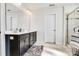 Bathroom featuring a double vanity, large mirror, and tiled walk-in shower at 14815 Superior St, Charlotte, NC 28273
