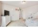 Bright bedroom featuring a feminine decor, a window view, and soft carpeting at 14815 Superior St, Charlotte, NC 28273