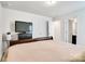 Well-lit bedroom featuring a modern tv and an airy feel, creating a restful sanctuary at 14815 Superior St, Charlotte, NC 28273