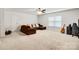 Bonus room with neutral carpet, natural lighting, and ceiling fan; perfect space for relaxing at 14815 Superior St, Charlotte, NC 28273