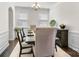 Formal dining room with elegant decor, chandelier, and wainscoting at 14815 Superior St, Charlotte, NC 28273