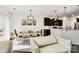 Dining room with a decorative chandelier and view into modern kitchen at 14815 Superior St, Charlotte, NC 28273