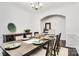 Spacious dining room with table set for a meal, wainscotting and arched doorway at 14815 Superior St, Charlotte, NC 28273