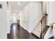 Elegant foyer with dark hardwood floors, staircase, and decorative accents at 14815 Superior St, Charlotte, NC 28273