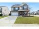 Charming two-story home with landscaped yard, covered porch, and two car garage at 14815 Superior St, Charlotte, NC 28273
