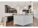 Open kitchen with black cabinetry, granite countertops, and stainless steel appliances at 14815 Superior St, Charlotte, NC 28273