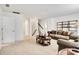 Open living room area with neutral walls, carpet, and lots of natural light at 14815 Superior St, Charlotte, NC 28273