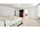 Spacious main bedroom with a sitting area, TV, and neutral carpeting at 14815 Superior St, Charlotte, NC 28273