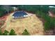 Aerial of property featuring a well-manicured lawn and tree-lined perimeter at 150 Belk Estate Dr, Mooresville, NC 28115