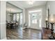 Inviting entryway with hardwood floors that opens to a dining area at 150 Belk Estate Dr, Mooresville, NC 28115