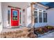 Welcome to this inviting entrance with a vibrant red door, decorative welcome sign, and tasteful landscaping at 150 Belk Estate Dr, Mooresville, NC 28115
