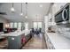 Open kitchen with stainless appliances, a spacious island, and seamless flow into the living area at 150 Belk Estate Dr, Mooresville, NC 28115