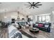 Bright, open living area featuring modern finishes, a large ceiling fan, and seamless access to the kitchen at 150 Belk Estate Dr, Mooresville, NC 28115