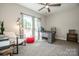 Bright home office provides natural light and features a modern desk, ample storage, and a comfortable seating area at 150 Belk Estate Dr, Mooresville, NC 28115