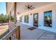 Expansive covered porch features ceiling fans and a serene wooded view at 150 Belk Estate Dr, Mooresville, NC 28115