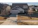 Aerial view of a single Gathering home and its well-maintained front yard with attached garage at 15035 Batteliere Dr, Charlotte, NC 28278