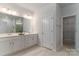 The bathroom offers double sink vanity with modern fixtures, and an entrance to a closet at 15035 Batteliere Dr, Charlotte, NC 28278