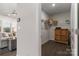 View into a walk-in closet with wooden cabinet and wire shelving at 15035 Batteliere Dr, Charlotte, NC 28278