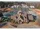 Aerial view of the Palisades clubhouse, tennis courts, and manicured landscaping at 15035 Batteliere Dr, Charlotte, NC 28278