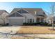 Charming single-Gathering home featuring a two-car garage, well-manicured lawn, and inviting curb appeal at 15035 Batteliere Dr, Charlotte, NC 28278