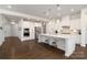Spacious white kitchen featuring a large island with seating at 15035 Batteliere Dr, Charlotte, NC 28278