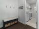 Convenient laundry area with modern washer and dryer, storage shelves, and custom bench at 15035 Batteliere Dr, Charlotte, NC 28278