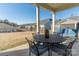 A beautiful outdoor patio with comfortable seating and a serene backyard view at 15035 Batteliere Dr, Charlotte, NC 28278