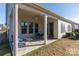 A covered patio with a seating area perfect for outdoor relaxation at 15035 Batteliere Dr, Charlotte, NC 28278