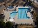 Aerial view of a community pool featuring lap lanes, a water slide, and a leisure area at 15035 Batteliere Dr, Charlotte, NC 28278