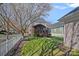 Beautiful backyard featuring a screened porch, well-maintained lawn, and mature trees at 16504 Knox Run Rd, Huntersville, NC 28078