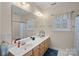 Bathroom with double sinks, a large mirror, and a shower/tub combination at 16504 Knox Run Rd, Huntersville, NC 28078