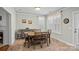 Bright dining area with ample seating and natural light from large windows at 16504 Knox Run Rd, Huntersville, NC 28078