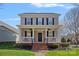 Charming two-story home featuring a welcoming front porch and well-maintained landscaping at 16504 Knox Run Rd, Huntersville, NC 28078