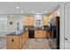 Spacious kitchen featuring wood cabinetry, stainless steel appliances, and a center island at 16504 Knox Run Rd, Huntersville, NC 28078