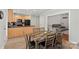 Open kitchen and dining area with stainless steel appliances and ample counter space at 16504 Knox Run Rd, Huntersville, NC 28078