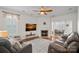 Cozy living room with a fireplace, comfortable seating, and an open layout at 16504 Knox Run Rd, Huntersville, NC 28078