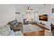 Inviting living room featuring a fireplace, wood floors, and plenty of seating at 16504 Knox Run Rd, Huntersville, NC 28078